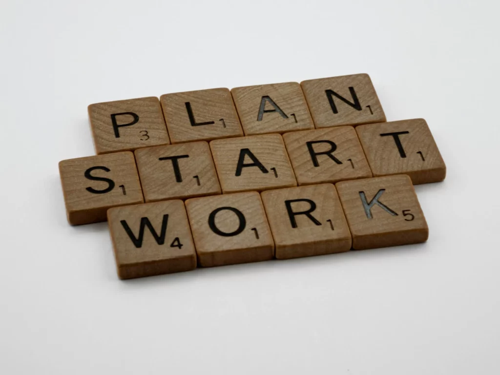 Scrabble tiles spelling Plan, Start, Work representing starting a 30 day trading action plan.
